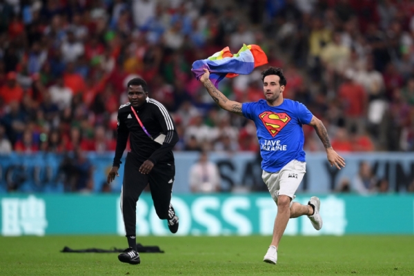 Fan storms pitch with pride flag between Portugal vs Uruguay match